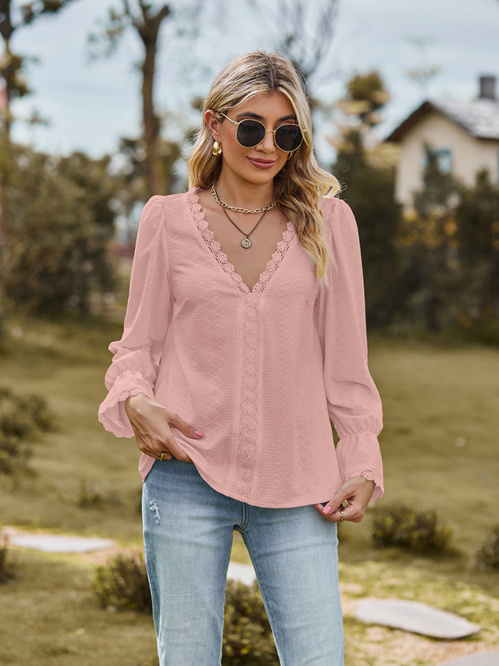Blush pink textured blouse with lace trim neckline and cuffs