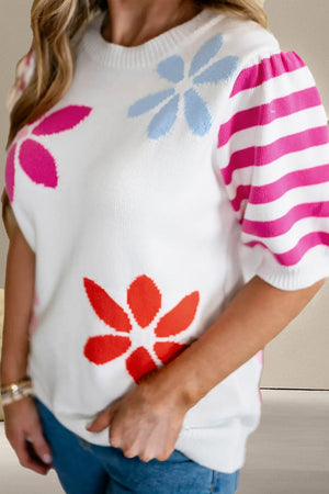 White knit top with puff sleeves featuring floral print and pink stripes.
