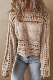 Dust Storm acrylic cable knit sweater with cutout details and crew neck.