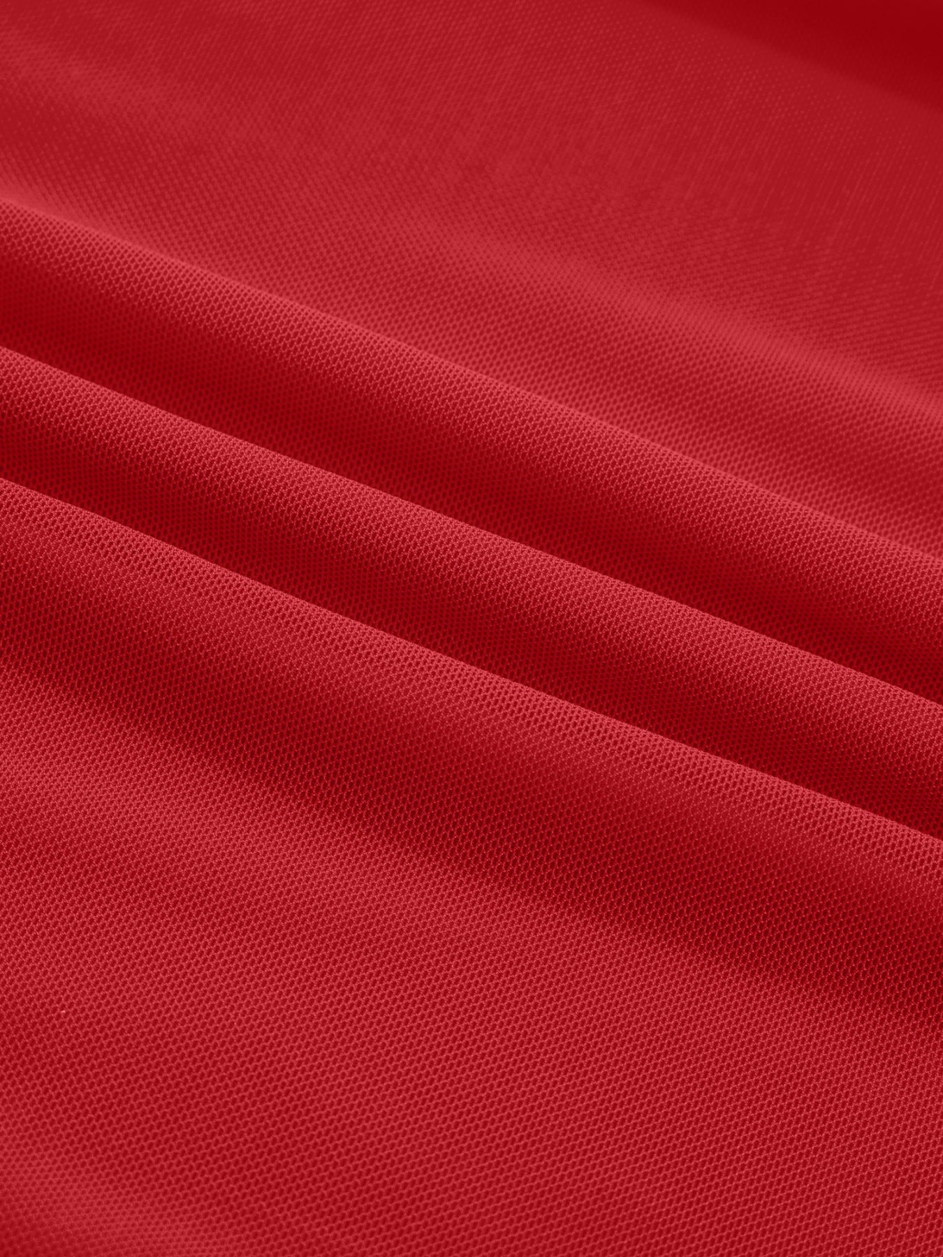 Deep red sheer mesh fabric with a honeycomb pattern, showing texture and drape.
