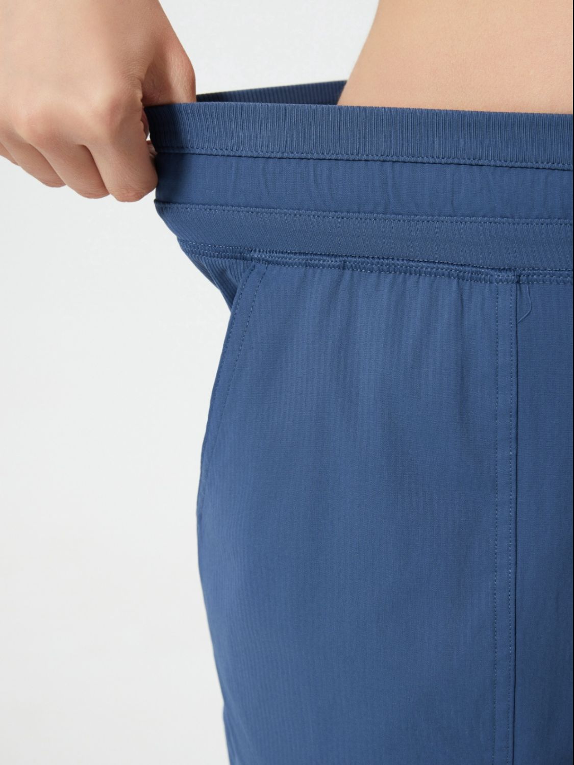Dusty blue utility shorts with elastic waistband and drawstring detail