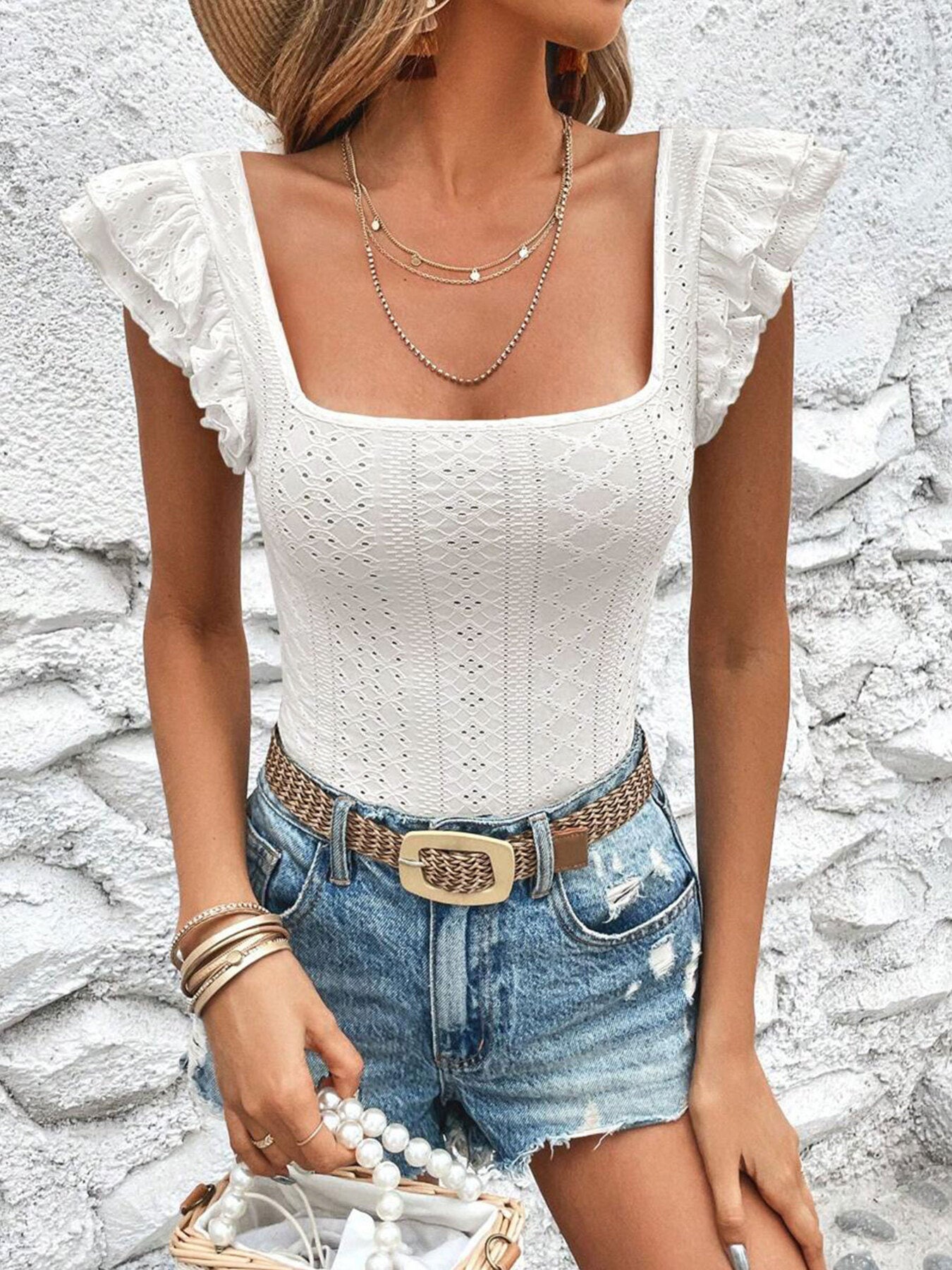 White ruffled square neck t-shirt with eyelet detail and cap sleeves.