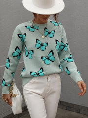 Sky blue knit crewneck sweater with allover butterfly motif and black trim.