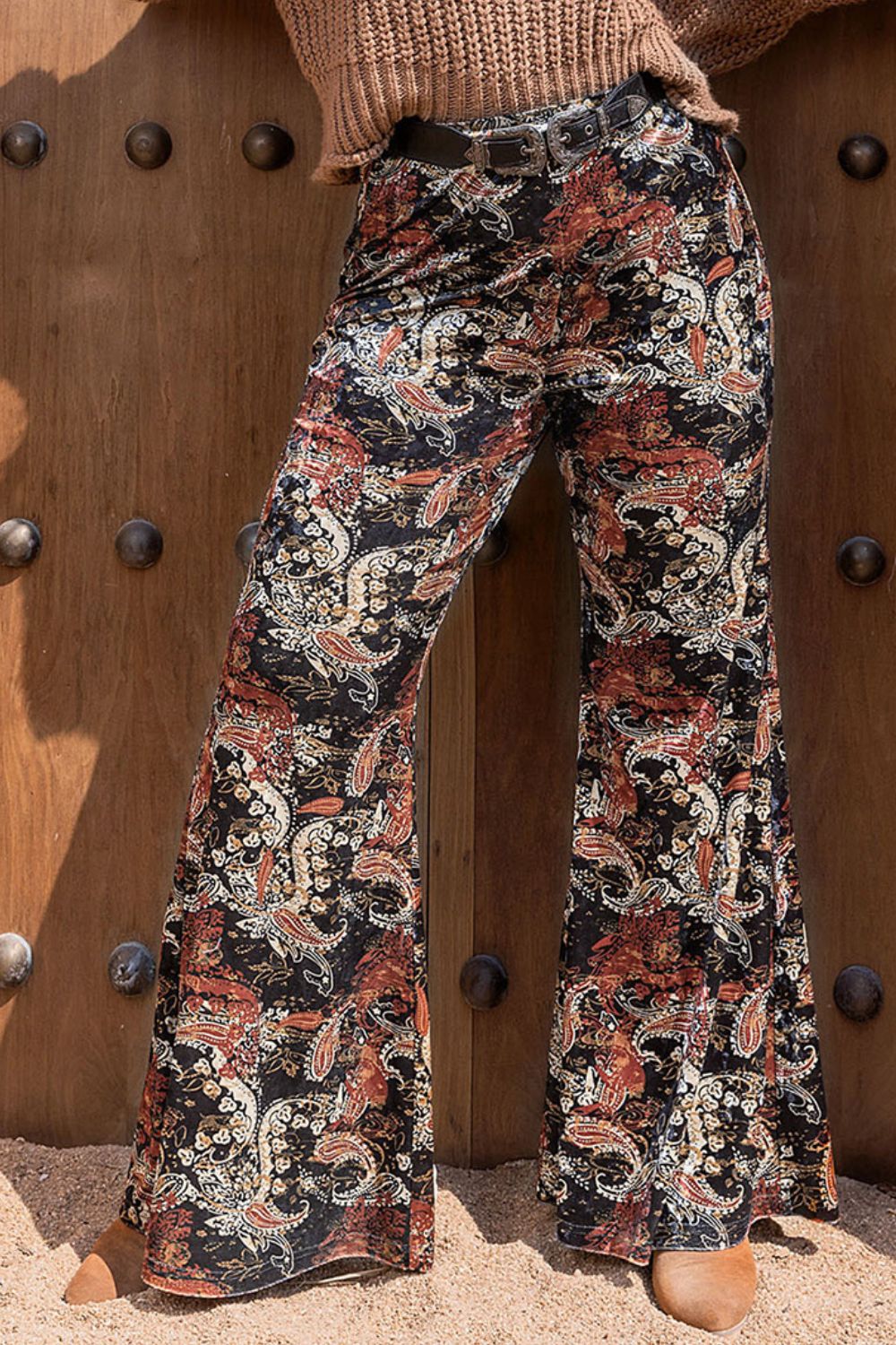 Velvet palazzo trousers in black with a paisley print and wide leg