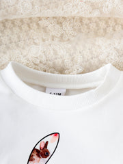 White baby crew neck sweatshirt with a watercolor bunny print and ribbed collar.