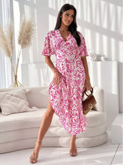 Hot pink and white abstract pattern midi dress with flutter sleeves and a v-neck.