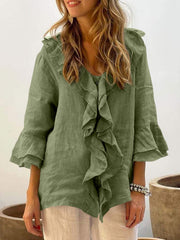 Ruffled linen blouse in olive green with flared sleeves and V-neck.
