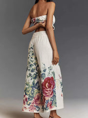 Chic floral print tube top and wide-leg pants set with ruched detail.