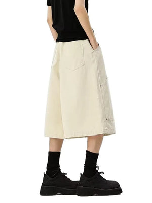 Relaxed fit apricot cargo shorts with utility pockets and a below-knee length.