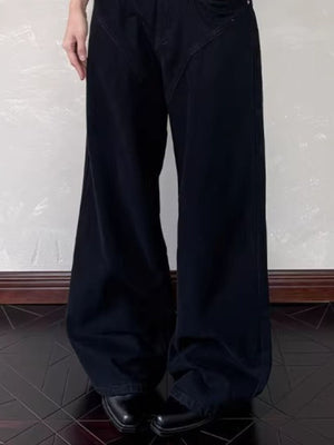 Black cotton belted wide leg jeans with a relaxed fit.