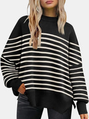 Black and white striped knit sweater with slouchy sleeves and a mock neck.