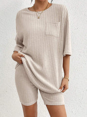 Relaxed ribbed lounge set in Dust Storm, featuring a short-sleeve top with pocket and matching biker shorts.
