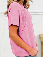 Pink mineral wash cotton tee with lace detail and notched neckline.