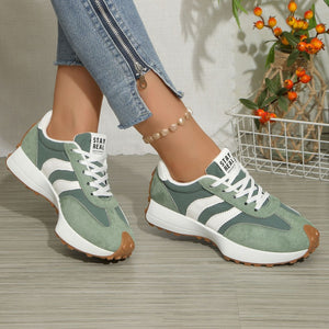 Green and white lace up round toe sneakers with chunky sole and brown toe cap
