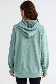 Textured raglan sleeve hoodie in Gum Leaf green with a relaxed fit and drawstring hood.