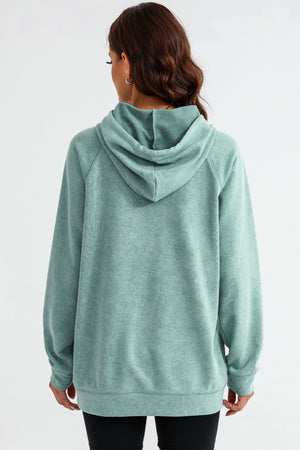 Textured raglan sleeve hoodie in Gum Leaf green with a relaxed fit and drawstring hood.