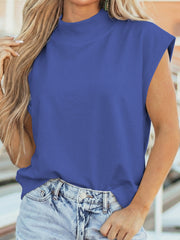 Ribbed mock neck cap sleeve shirt in Dusty Blue, styled with denim shorts.