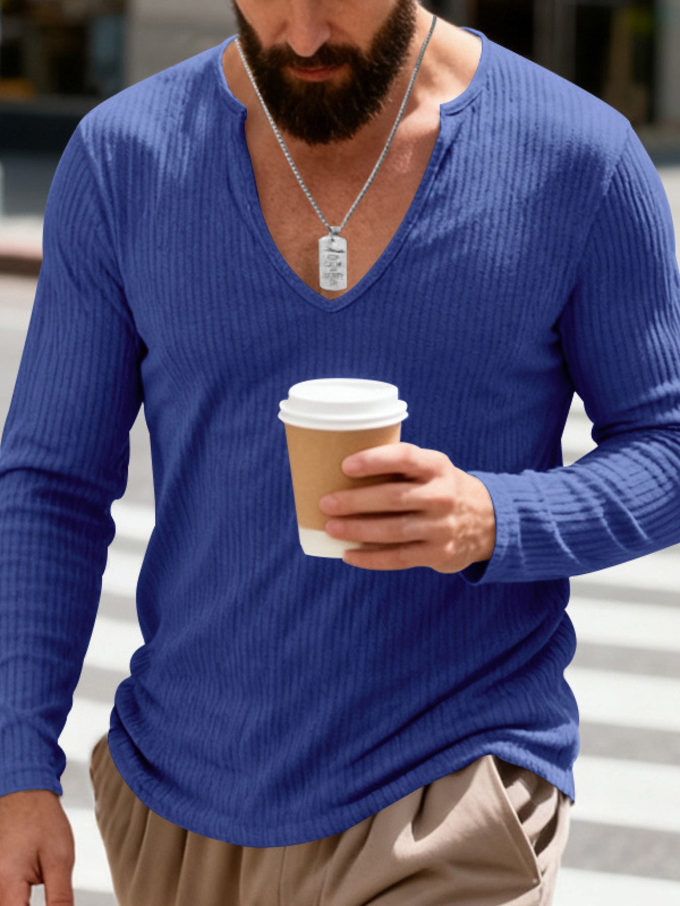 Royal Blue ribbed long sleeve t-shirt with deep V-neck, worn by a man holding a coffee cup.