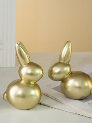 Elegant gold resin rabbit figurines, Style A and Style B, abstract contemporary decor.