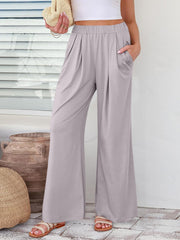 Light Gray pleated palazzo trousers with pockets and wide legs.