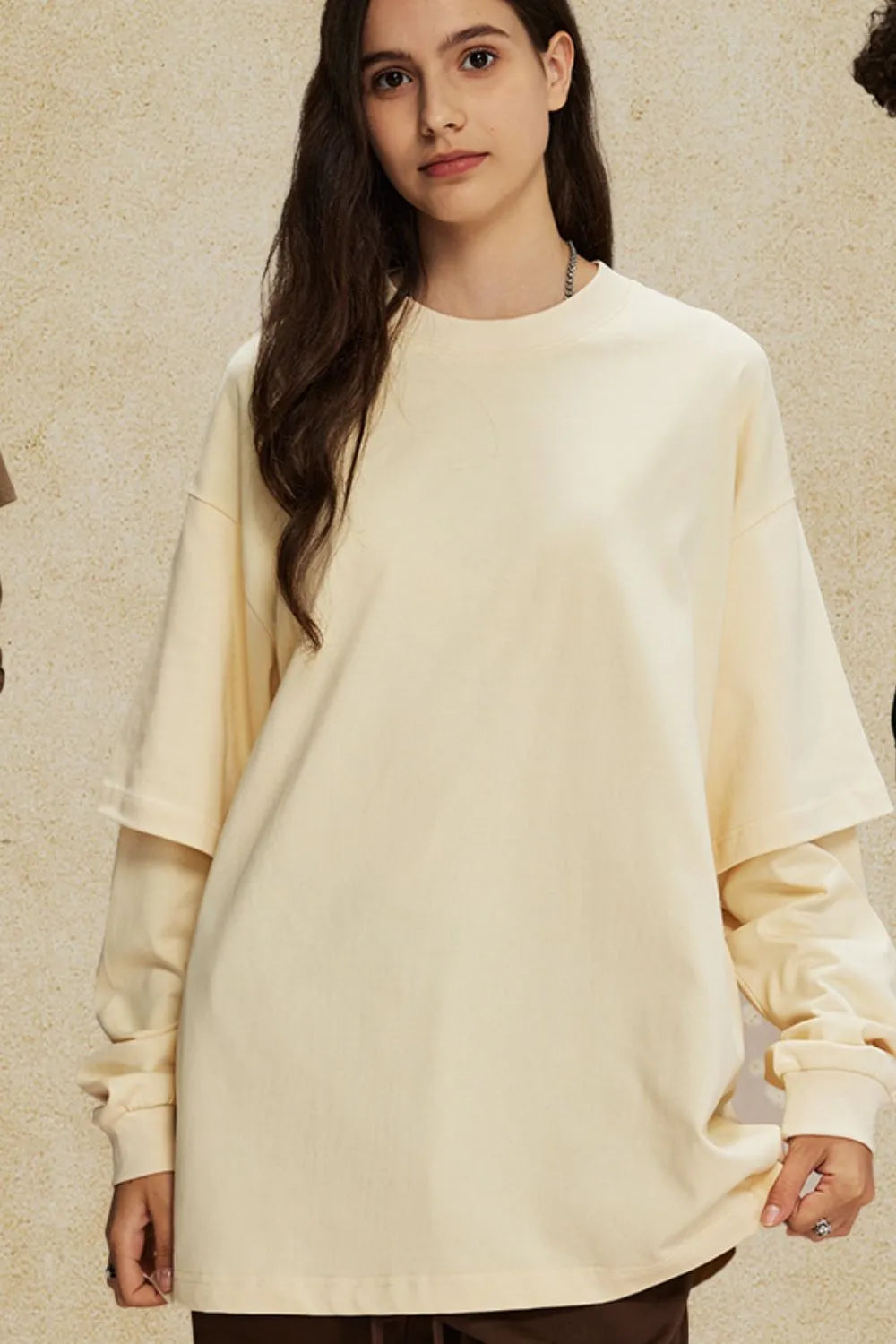 Beige oversized tee with layered long sleeves and crew neck