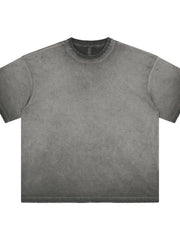 Distressed oversized gray washed effect t-shirt with raw hem and neckline.