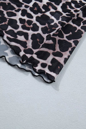 Leopard print sheer mesh t-shirt with lettuce trim hem detail.