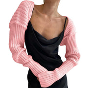 Blush pink ribbed knit shrug with extended sleeves and a casual, basic style.