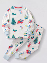White children's long sleeve pajama set with festive Christmas print of snowmen, trees, and gifts.