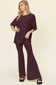 Oversized tee and flare leg pants set in deep red, with short sleeves and a round neckline.