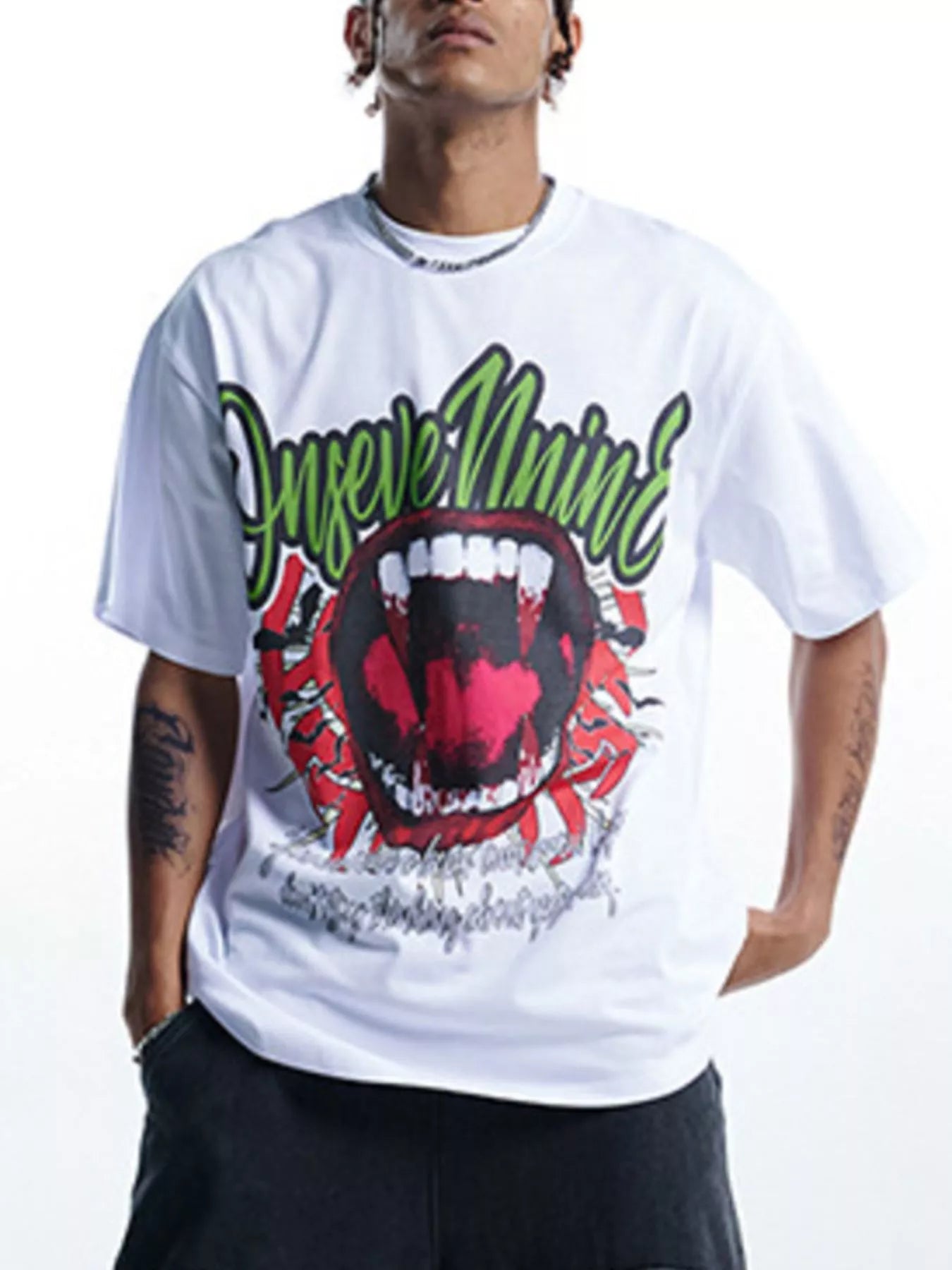 White 100% cotton oversized graphic t-shirt with bold red mouth and green text design.