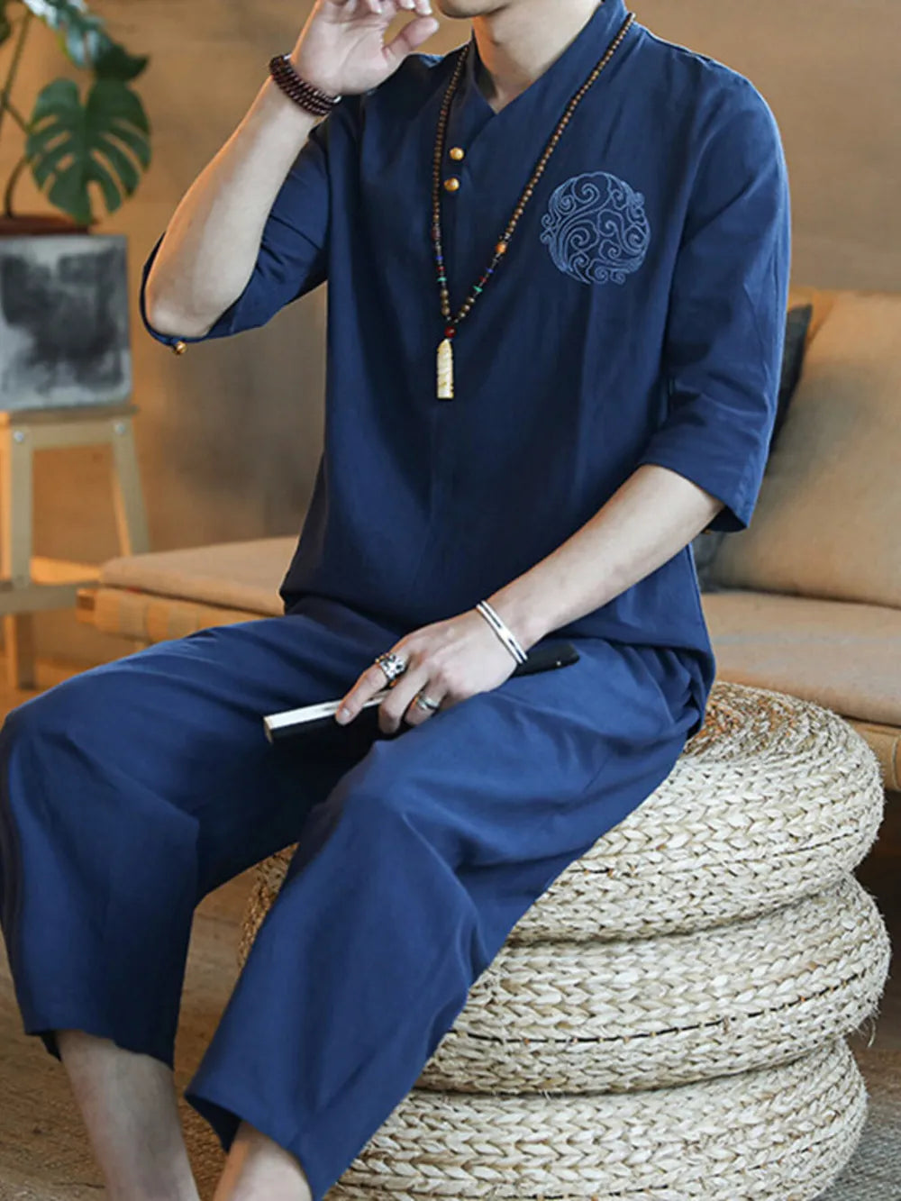 Navy blue men's 3/4 sleeve pants set with embroidered detail on shirt.