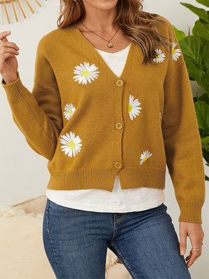 Mustard V-neck cardigan with daisy embroidery and button front.