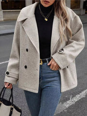 Light gray double-breasted wool blend pea coat with button details and lapel collar.
