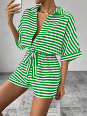 Green and white striped shirt romper with self-tie belt and button front.