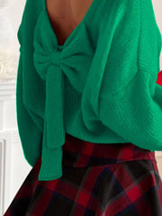 Green long-sleeve sweater with a large bow detail at the back.