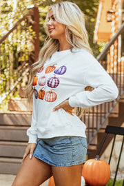 White crewneck sweatshirt with watercolor pumpkin patch print, casual autumn style.