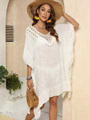 Ivory crochet yoke ruffle hem cover-up with wide sleeves and asymmetrical hem.
