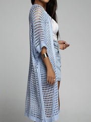 Light blue open-knit duster cardigan with a breathable acrylic weave.