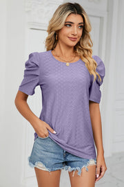 Purple perforated sleeve blouse with textured diamond pattern and puff sleeves.