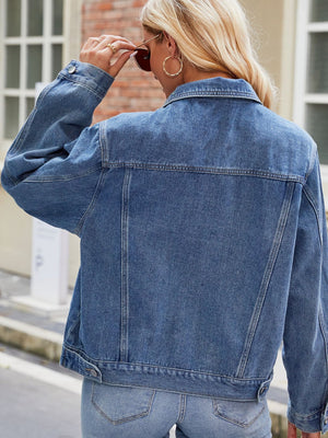 Faded denim boxy fit jacket with buttoned front and collar.