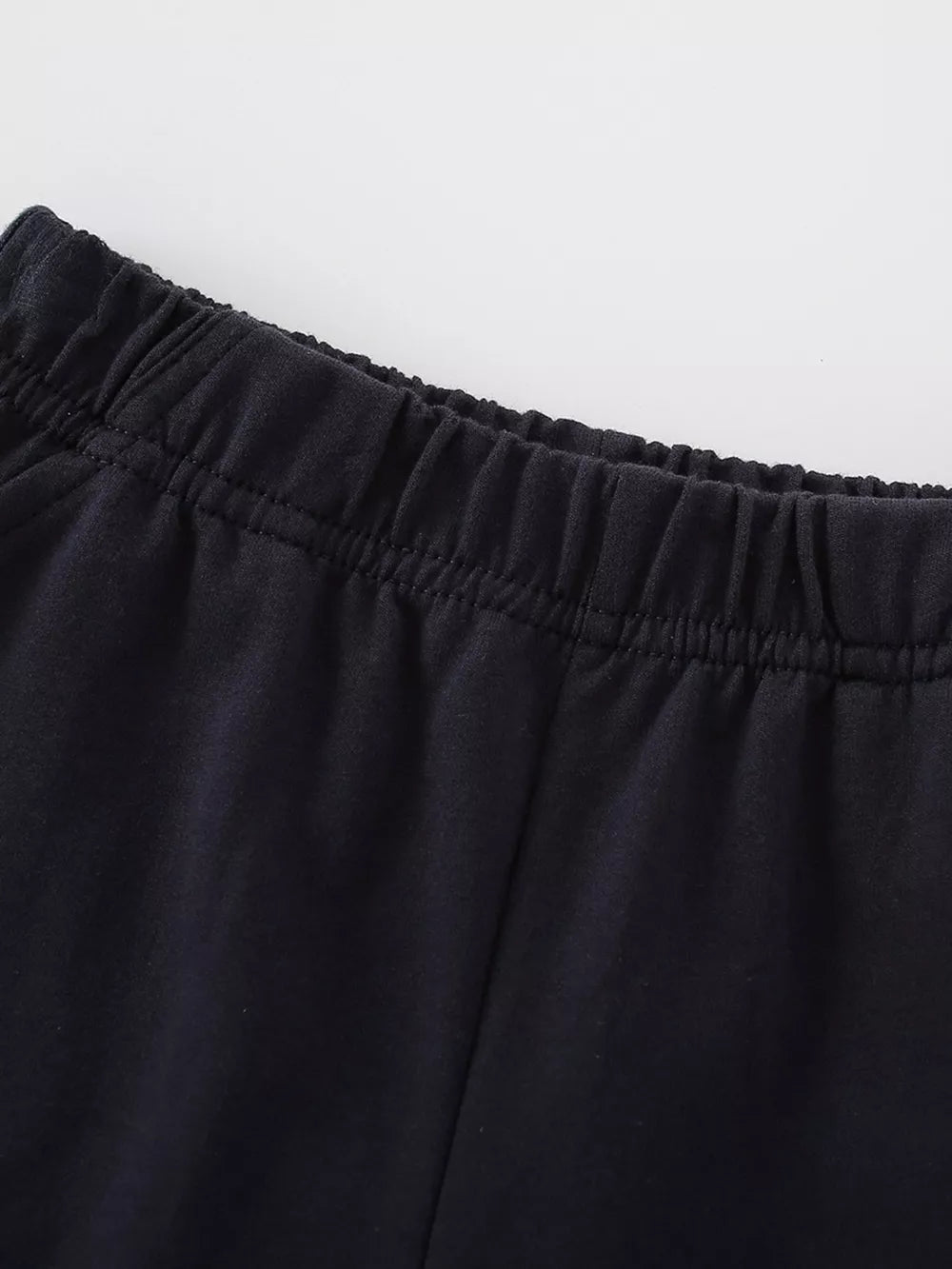 Black cotton toddler pants with elastic waistband detail