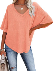 Coral pink waffle knit relaxed v-neck t-shirt with short sleeves.