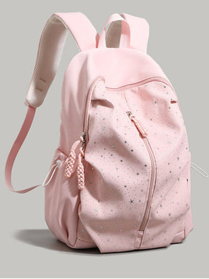 Pink nylon school backpack with silver star pattern and braided zipper pulls.