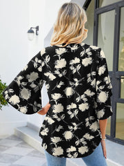 Black floral blouse with flutter sleeves and V-neck, 100% polyester.