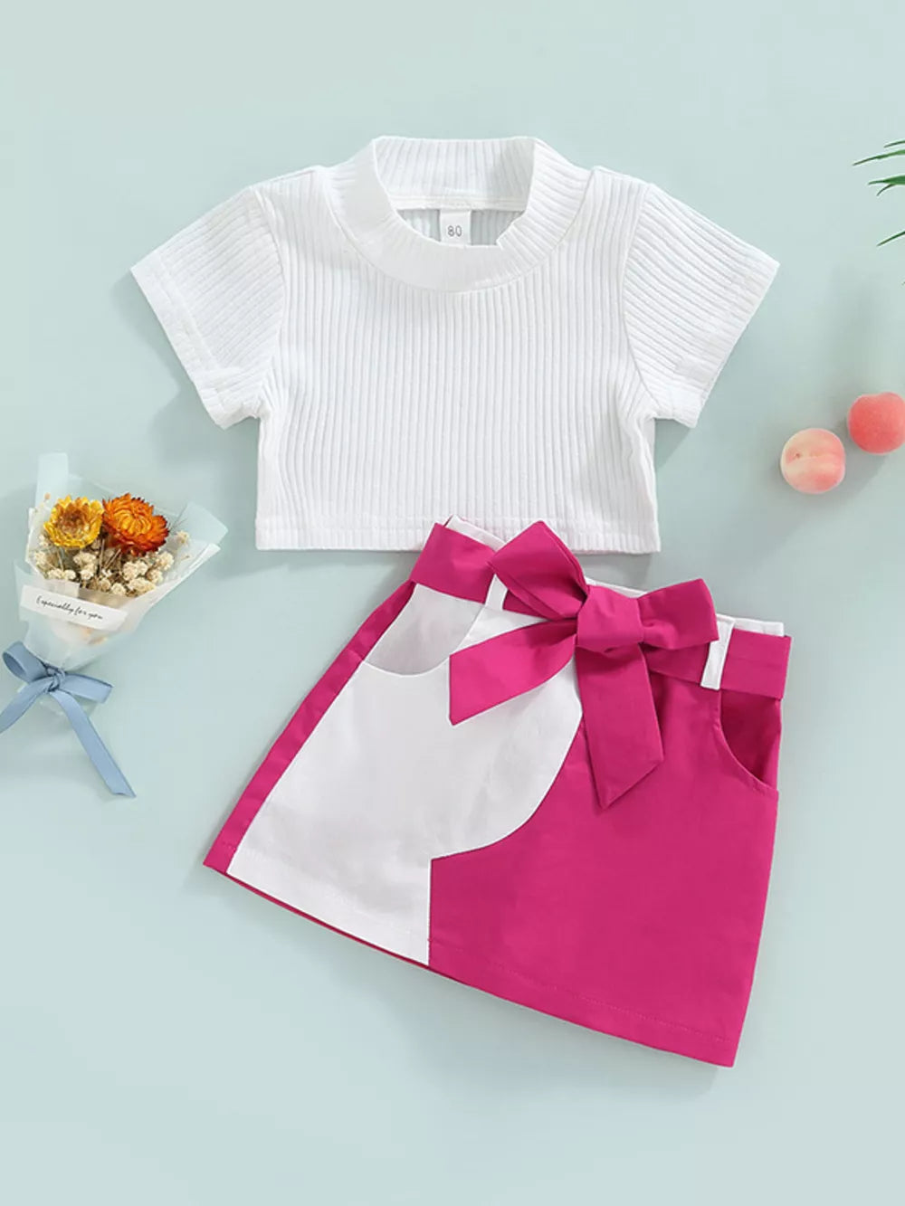 Baby knit top and skirt set in white and rose red with bow detail