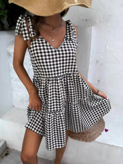 Black and white gingham tie-shoulder mini dress with tiered skirt