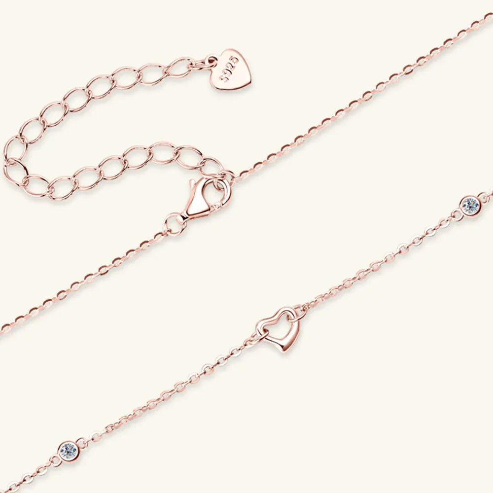 Rose gold linked heart pendant necklace with crystal accents and 925 stamp.