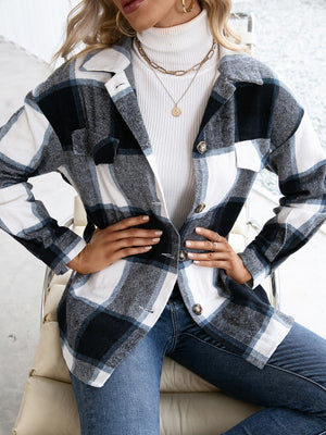 Belted black plaid overshirt with patch pockets and button-down front.