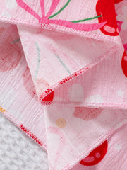Pink cotton blend toddler dress with cherry print and smocking detail.